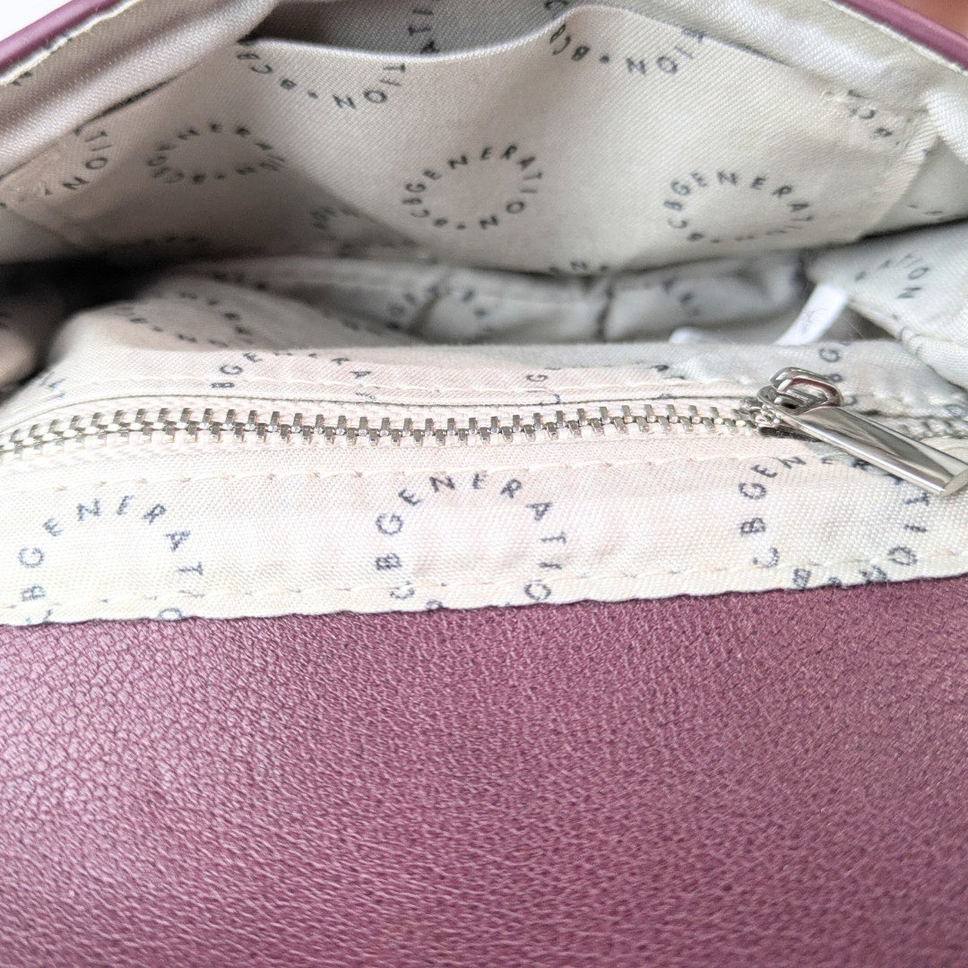 Interior of the BCBGeneration Shelya Studded Crossbody Bag in Plum