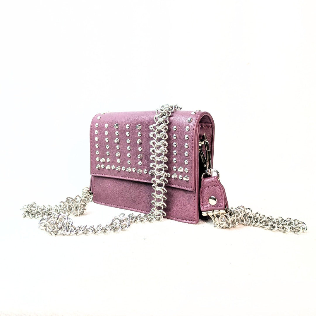 BCBGeneration Shelya Studded Crossbody Bag in Plum photographed from the left side