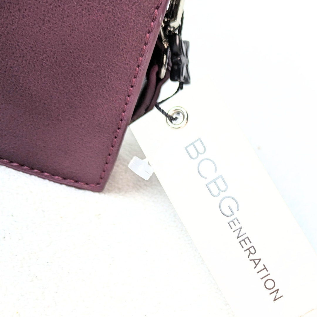 Tag of the BCBGeneration Shelya Studded Crossbody Bag in Plum