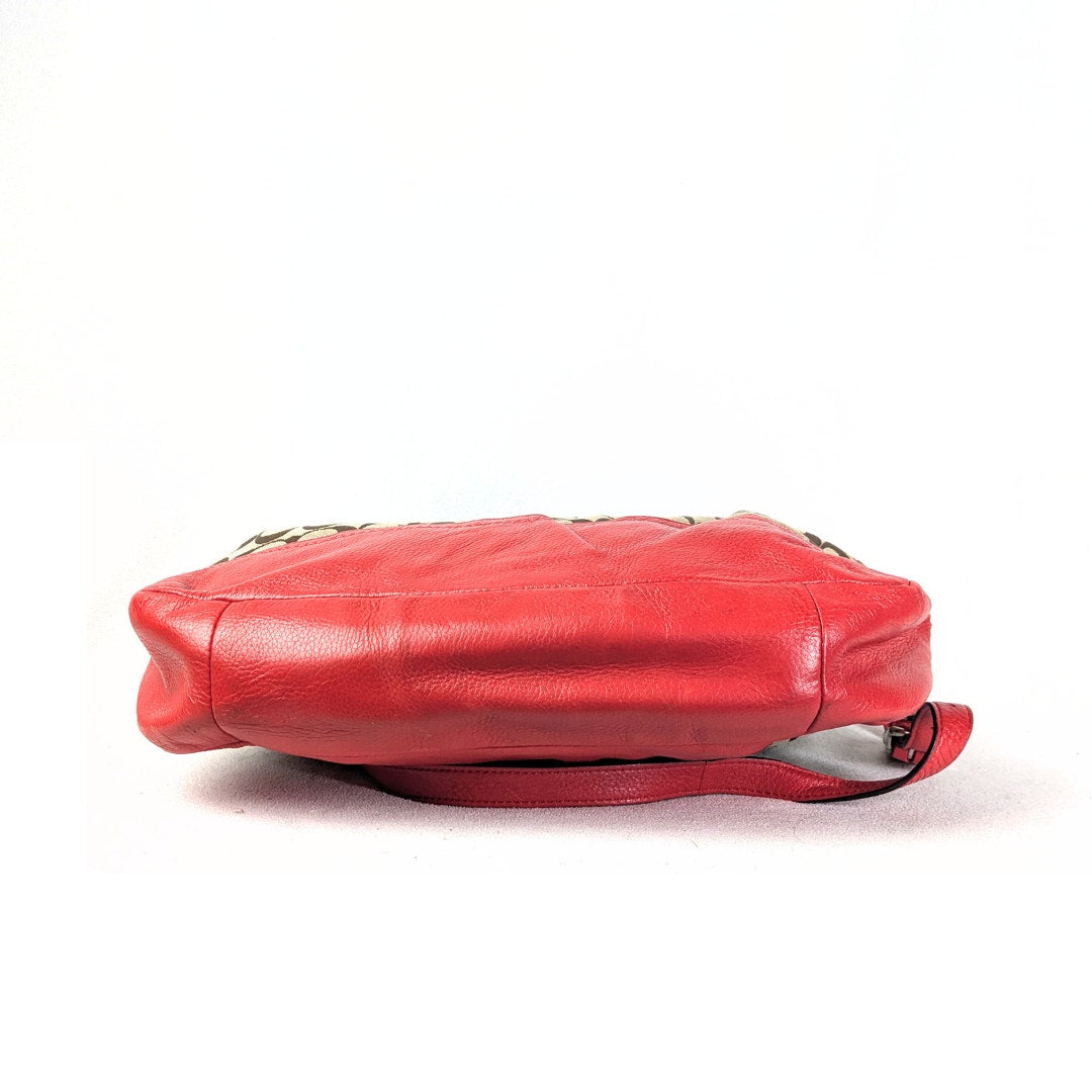 The view of the bottom of the COACH Chelsea Signature Jacquard Convertible Crossbody Bag, photographed on the white background.