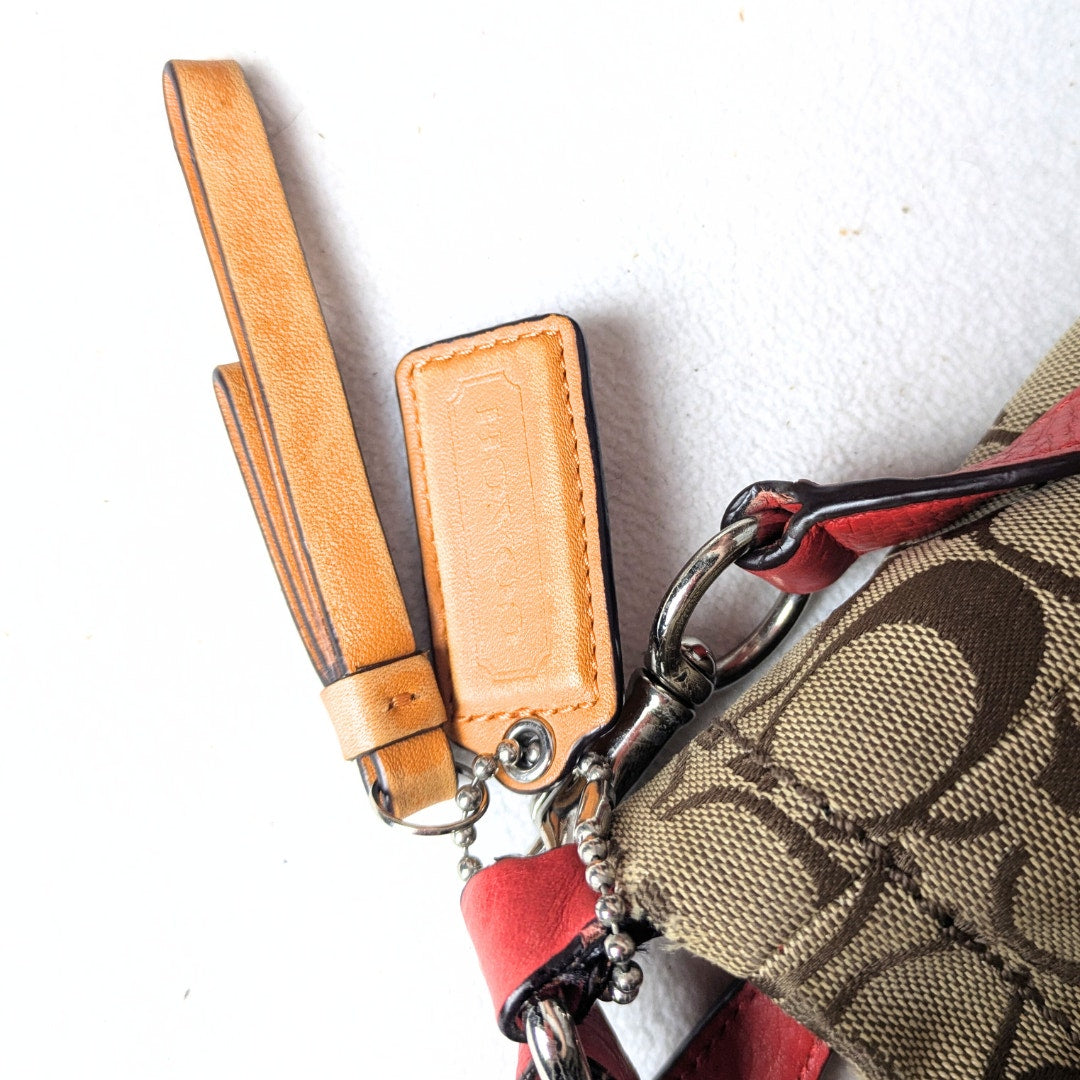 The view of the hangtag attached to the COACH Chelsea Signature Jacquard Convertible Crossbody Bag, photographed on the white background.