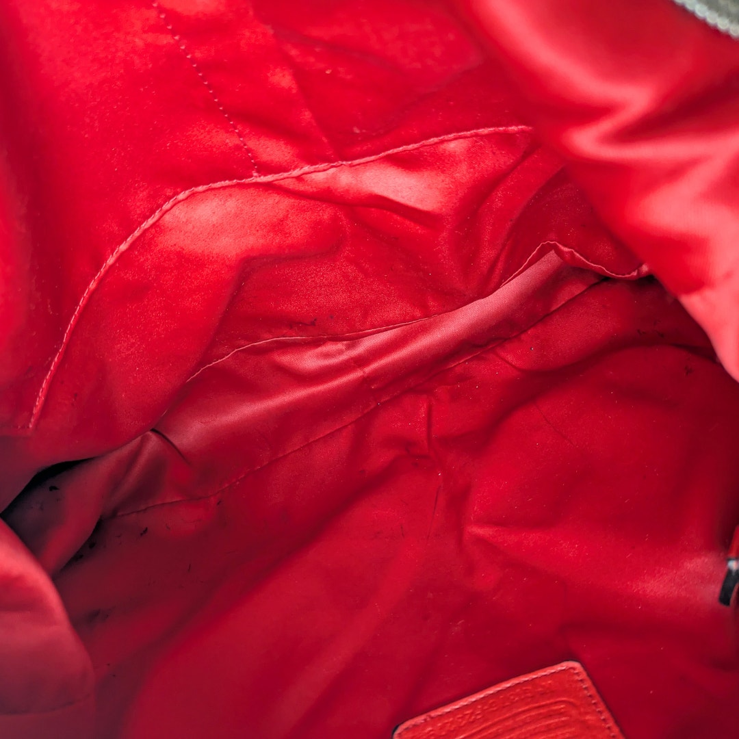 The vie wof the inside of the COACH Chelsea Signature Jacquard Convertible Crossbody Bag.