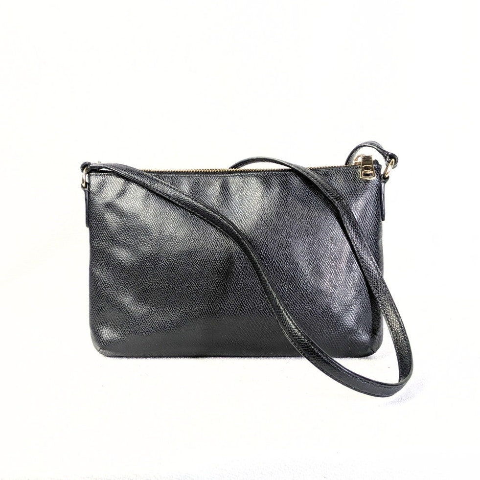 The back side of the COACH Polly Crossgrain Leather Crossbody Bag photographed on the white background.
