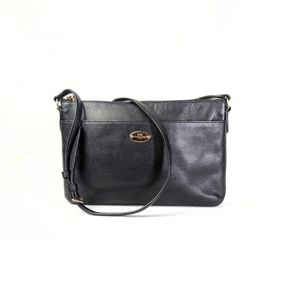 The fornt view of the COACH Polly Crossgrain Leather Crossbody Bag photographe don the white background.