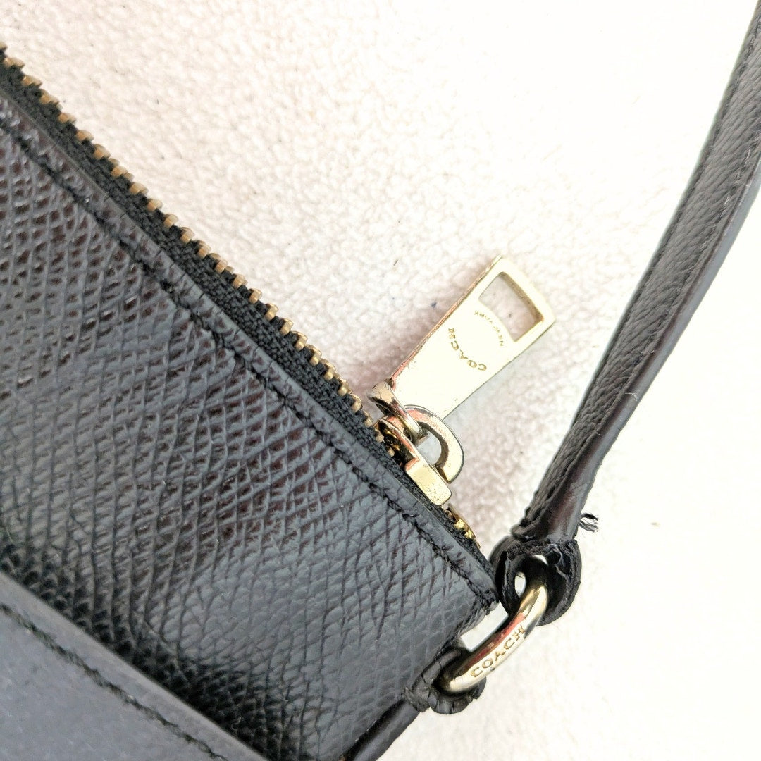 The view of the hardware of the COACH Polly Crossgrain Leather Crossbody Bag, photographed on the white background.