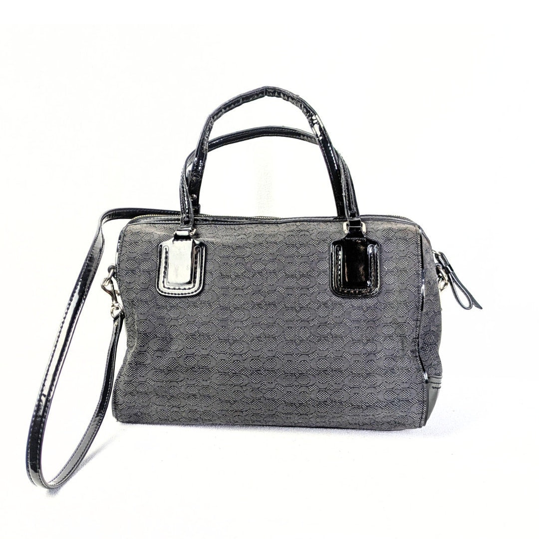 The back side of the COACH Poppy Mini Oxford Convertible Satchel Handbag captured on the white background.