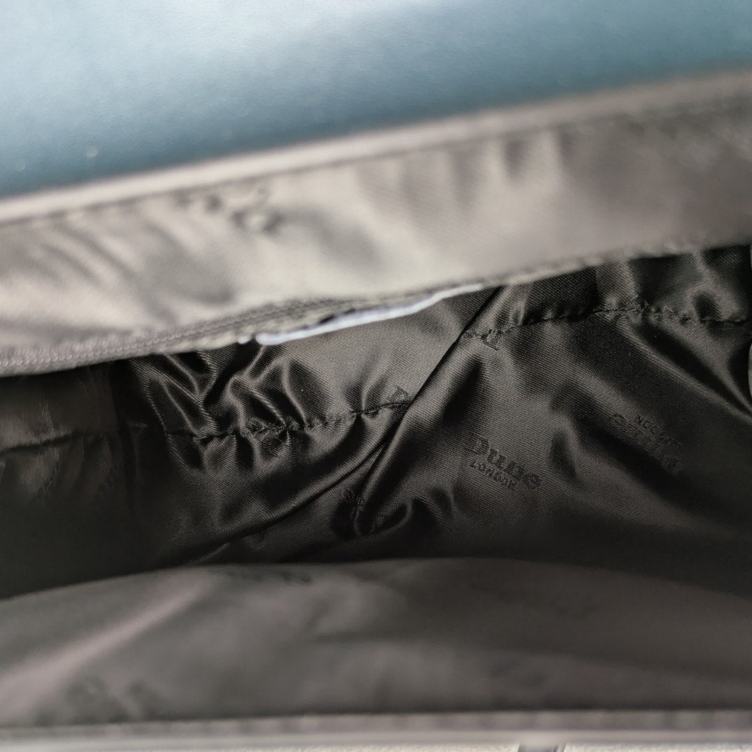 A close-up on the lined interior of the Dune London Purce Convertible Crossbody Satchel Handbag With a Wallet.