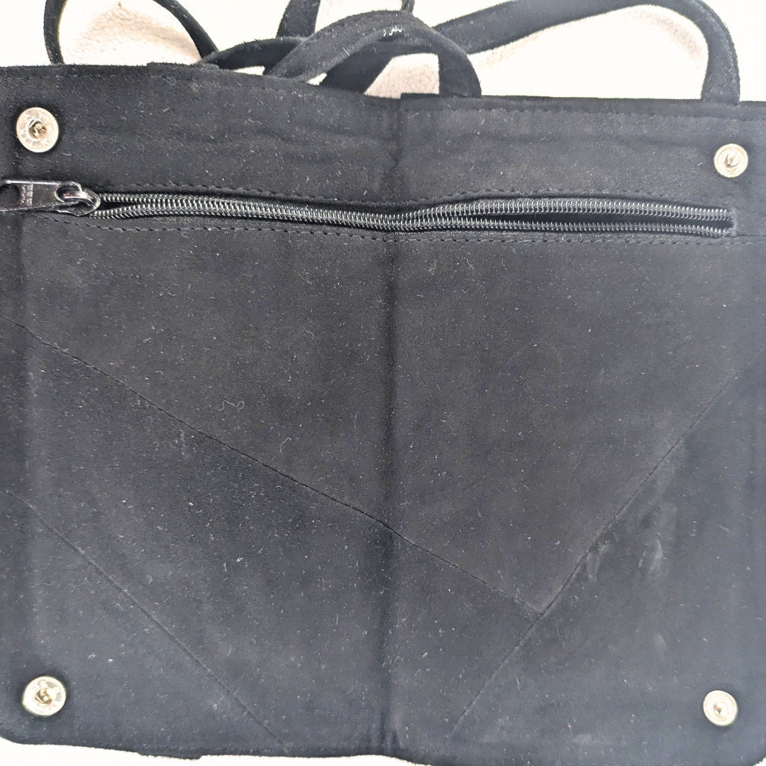 Handmade Convertible Soft Suede Embroidered Bag photographed inside.
