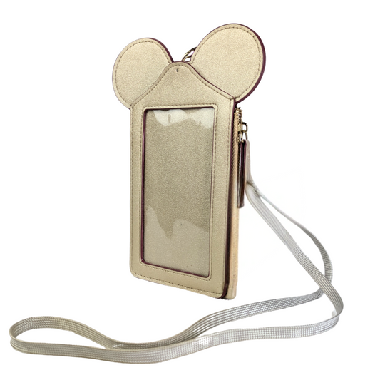 A gold faux leather Mickey Mouse ID/ Card Protector and Holder with a clear ID window, multiple card slots, a zippered change pocket, and an attached neck strap.