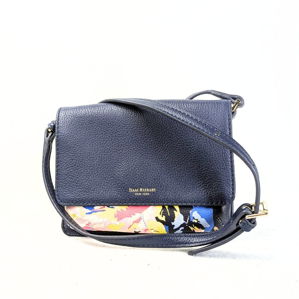 The front view of the Isaac Mizrahi Floral Print Faux Leather Crossbody Bag on the white background.