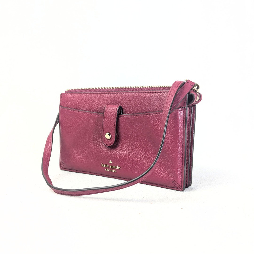 The view of the Burgundy Kate Spade Larchmont Avenue Alegra Crossbody Bag on the white backgorund.