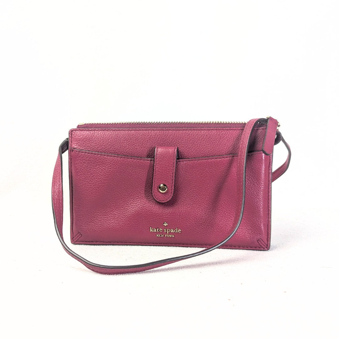 The front side of the Kate Spade Larchmont Avenue Alegra Crossbody Bag in Burgundy captured on the white background.