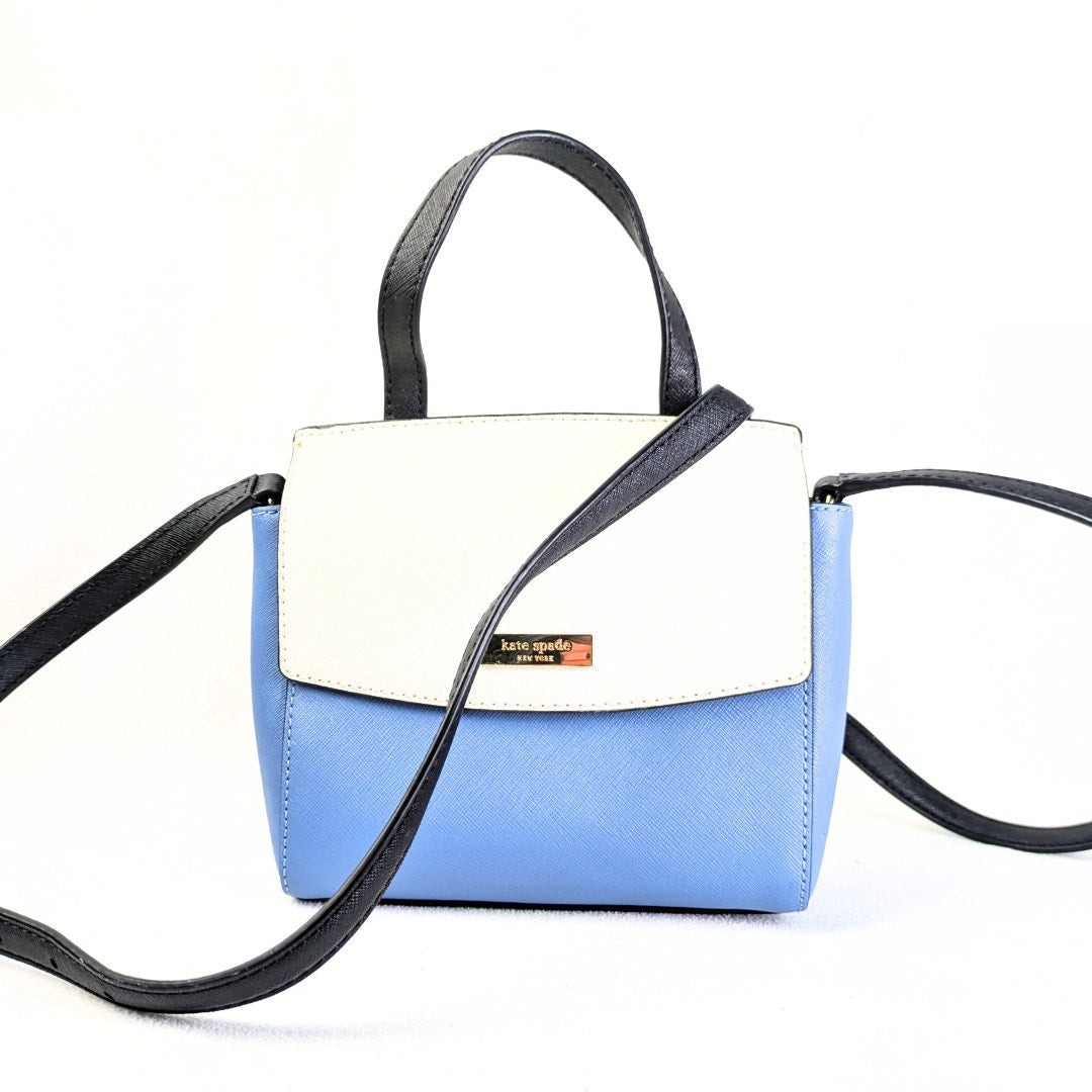 The front view of the Kate Spade Laurel Way Mini Alisanne Leather Crossbody Satchel Handbag on he white background.
