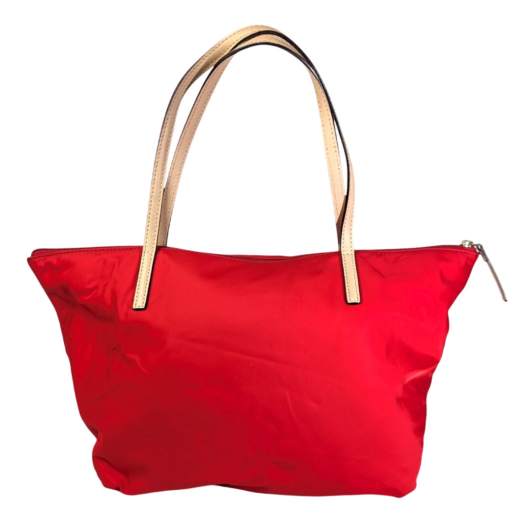 The back view of the Kate Spade May Street Lida Large Tote Shoulder Bag in Red on white background.