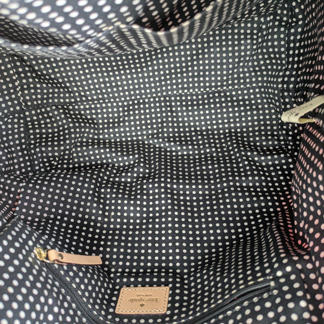 The polka dot print lining inside the Kate Spade May Street Lida Large Tote Shoulder Bag.