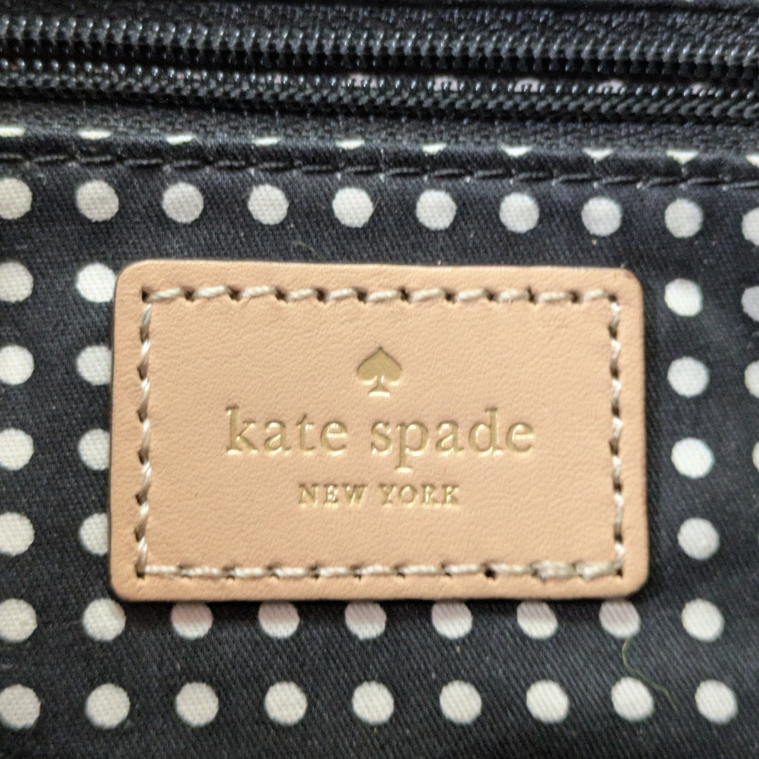 The logo patch inside the Kate Spade May Street Lida Large Tote Shoulder Bag.