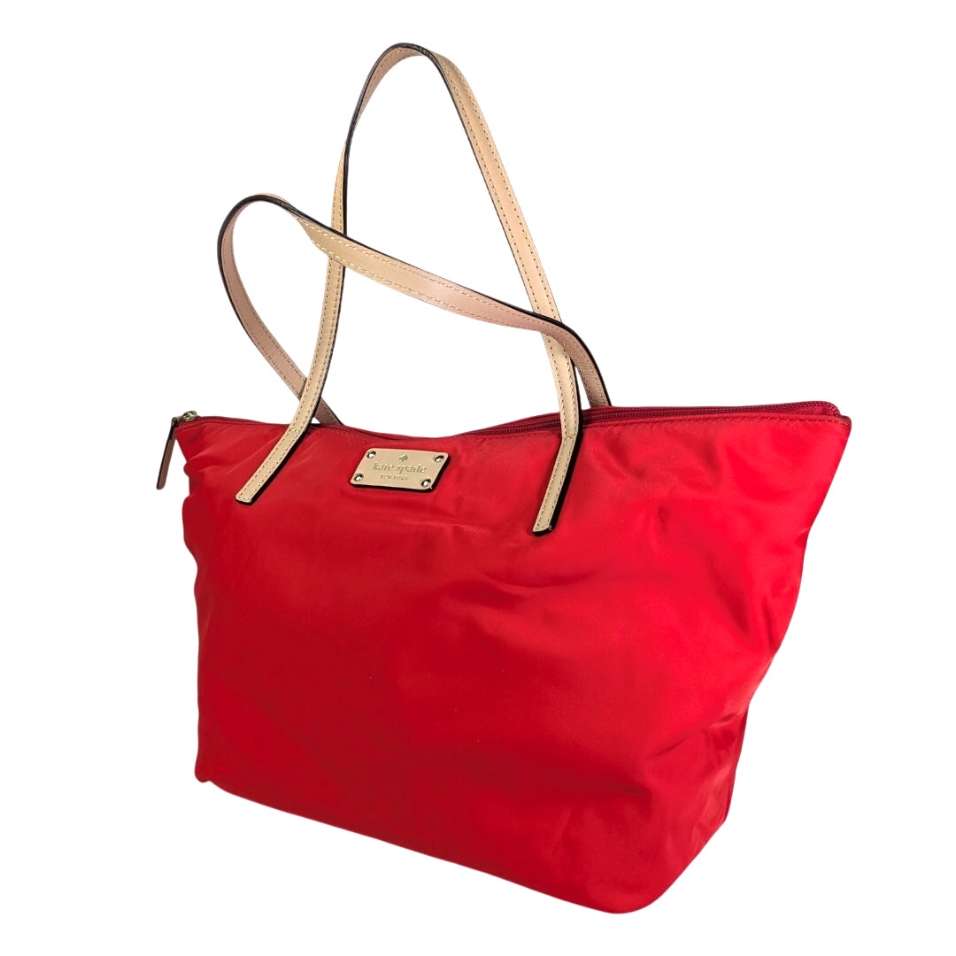 A pre-owned Kate Spade May Street Lida Large Tote Shoulder Bag with a red nylon exterior, light beige leather shoulder straps, and a front logo patch.