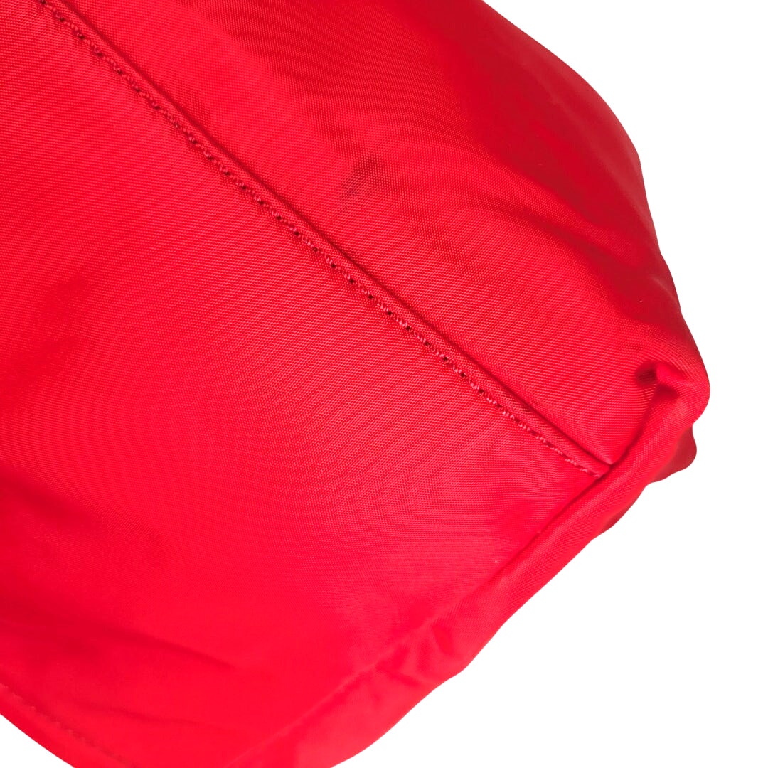 The close-up of the stain mark around the bottom of the Kate Spade May Street Lida Large Tote Shoulder Bag photographed on the white background.