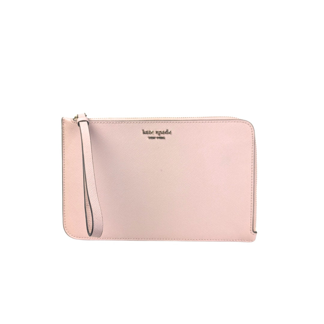 Pink wallet with a strap on a white background