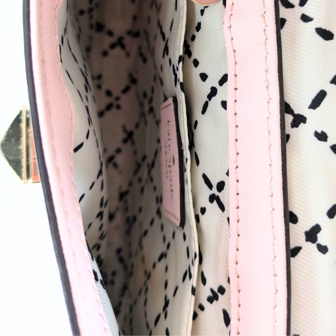 The view of the interior of the Kate Spade New York Newbury Lane Sally Crossbody Bag in Blush pink.