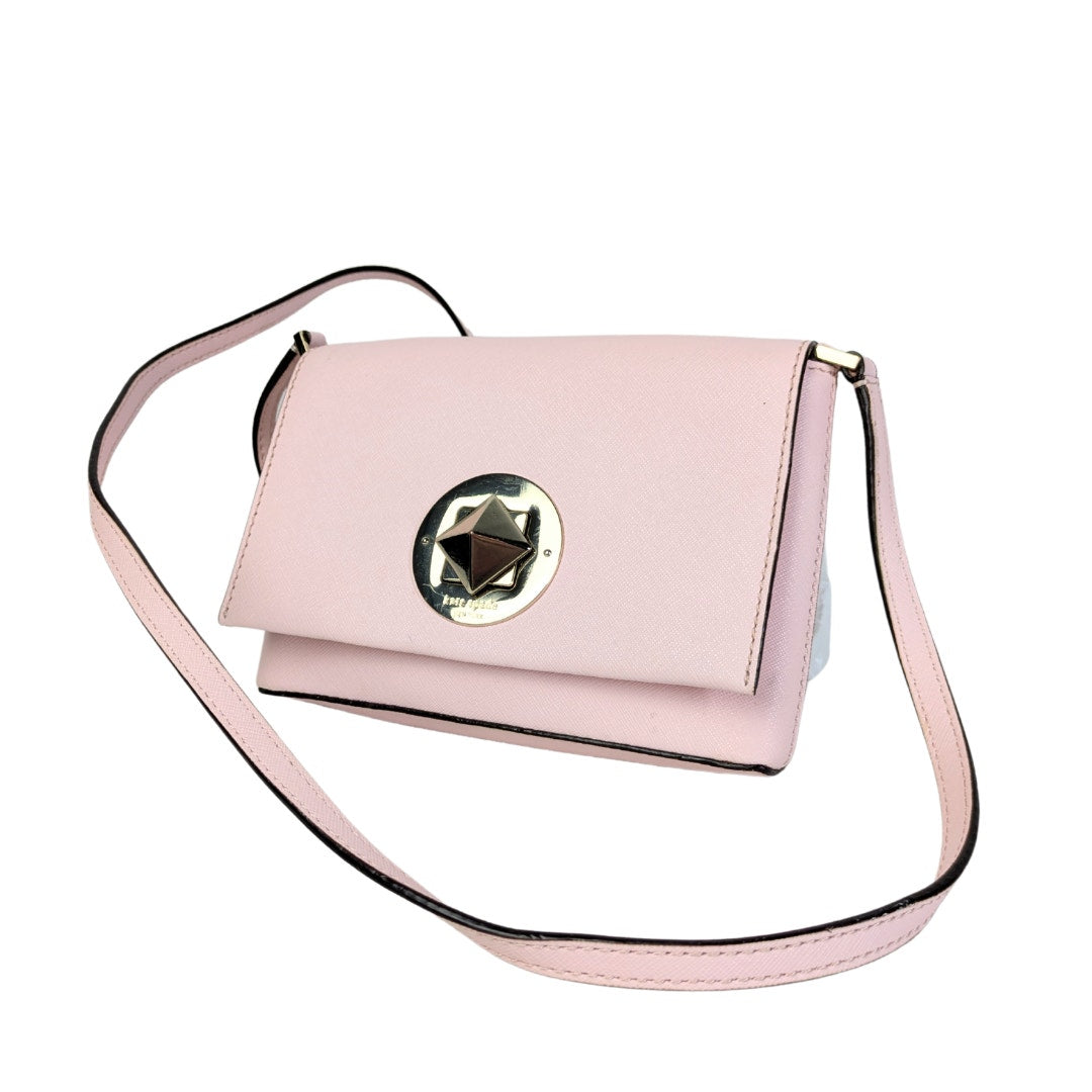 A pre-owned Kate Spade New York Newbury Lane Sally Crossbody Bag in blush pink saffiano leather with silver hardware.