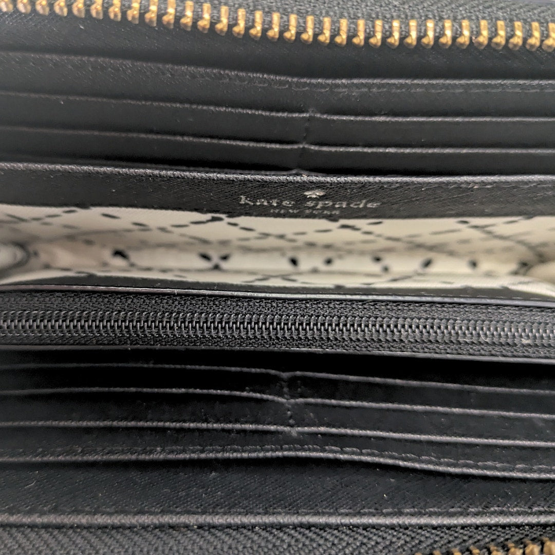 Interior of the Kate Spade Newbury Lane Neda Zip Continental Wallet.