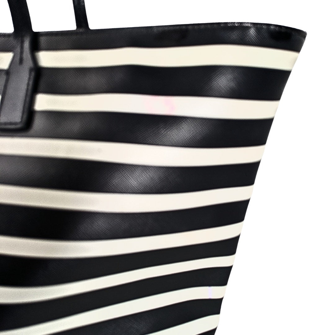 The saffiano exterior of the Kate Spade Shore Street Sailing Stripe Margareta Tote Shoulder Bag.
