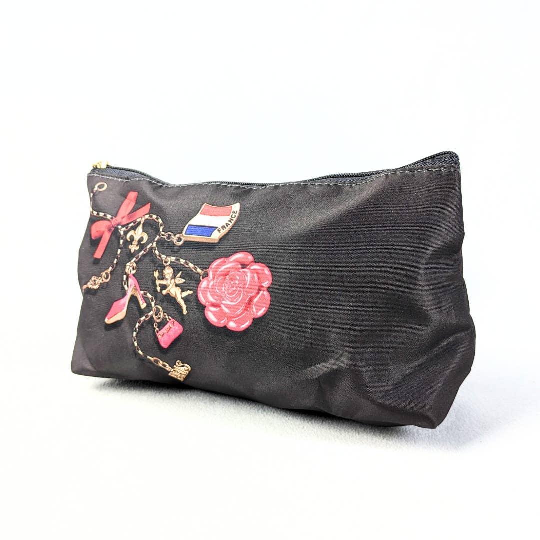 A brown Lancôme cosmetic bag with a Eiffel tower zipper handle and french-inspired multicolor prints.
