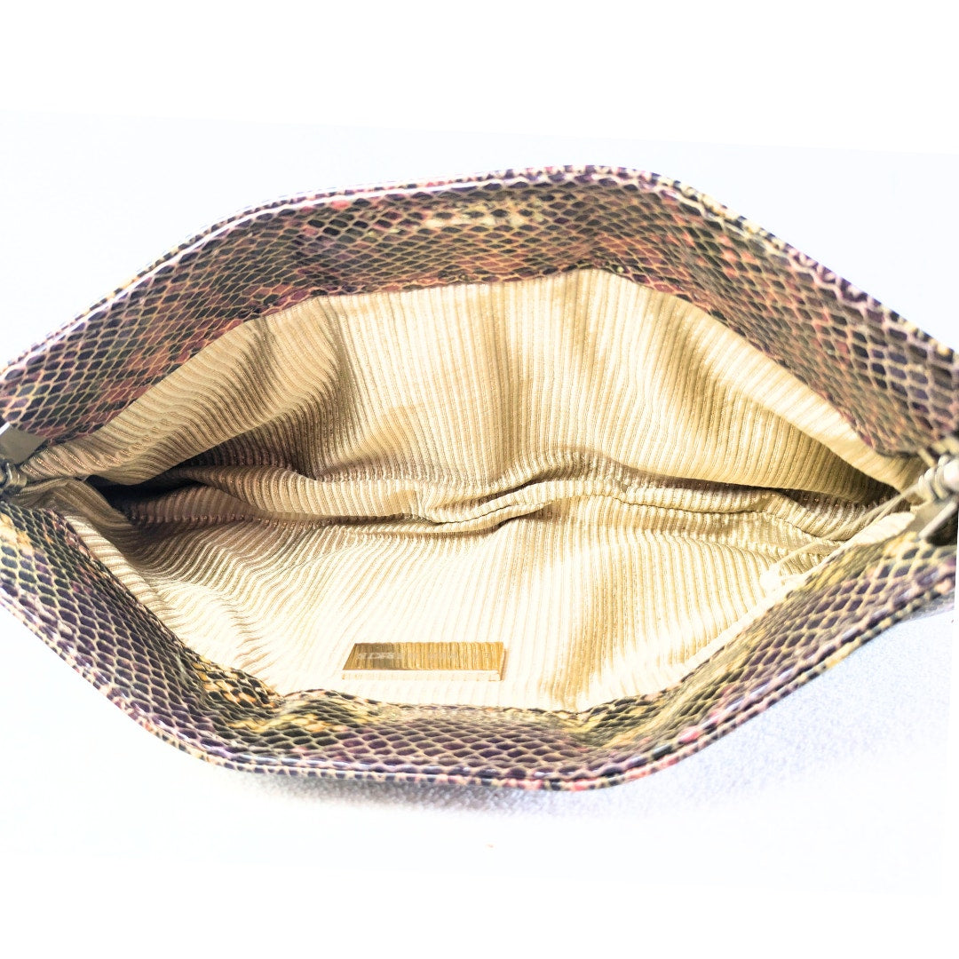 The inside of the Lauren Merkin Python Skin Pattern Faux Leather Clutch.
