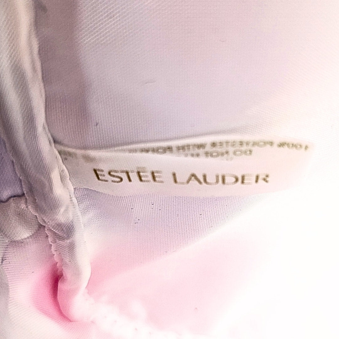 The logo tag inside the Lisa Perry for Estée Lauder Geometric Print Make-up Bag.