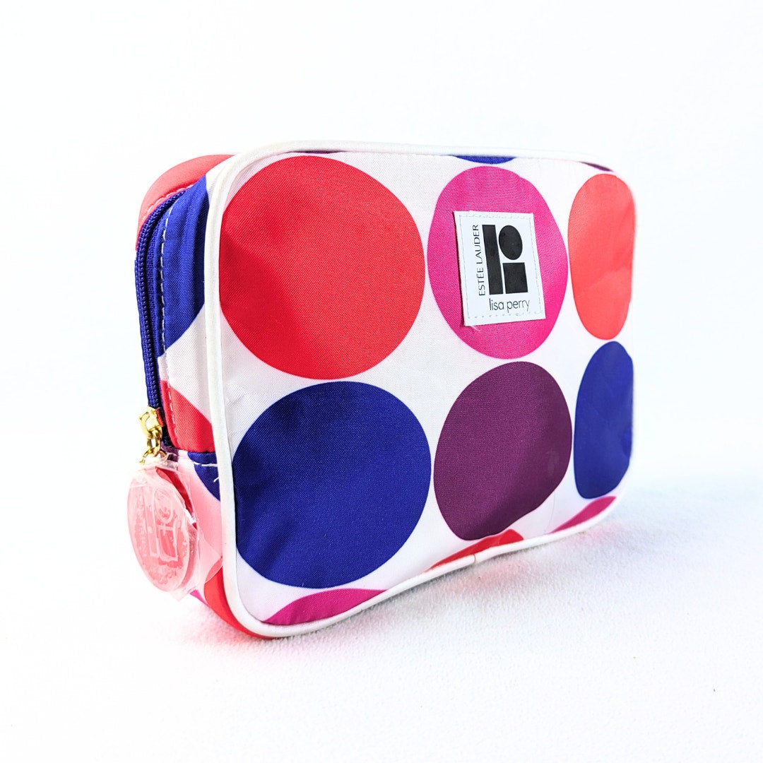 The front view of the Lisa Perry for Estée Lauder Geometric Print Make-up Bag photographed from the right angle.