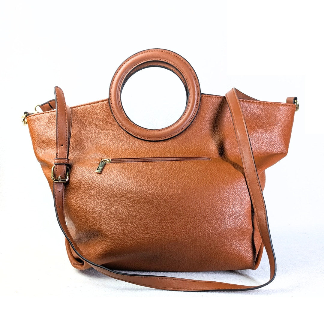 The back view of the London Fog Faux Leather Crossbody / Shoulder Handbag in Camel on the white background.