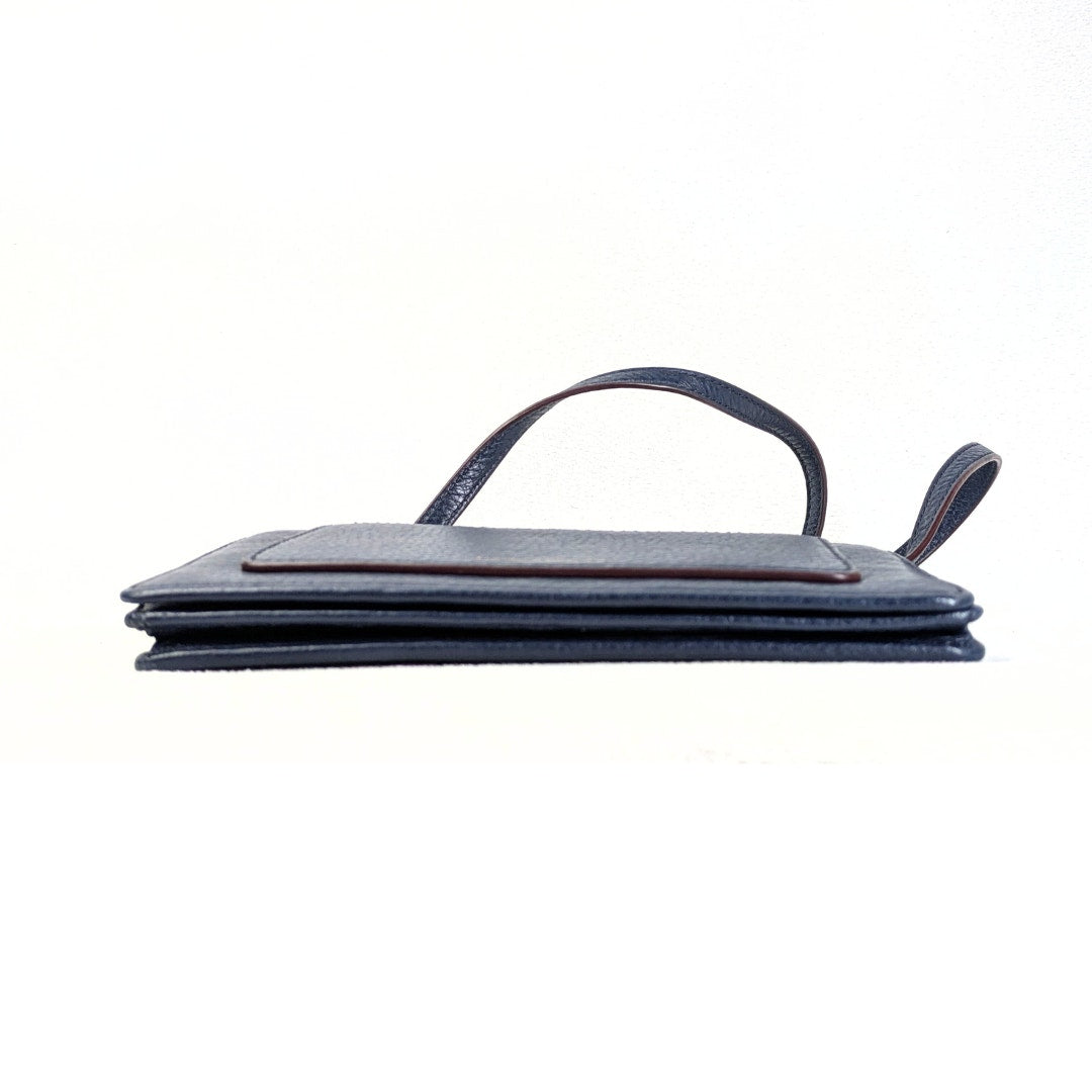 The view of the bottom of the Marc Jacobs Leather Recruit Wallet on a Crossbody Strap Handbag on the white background.
