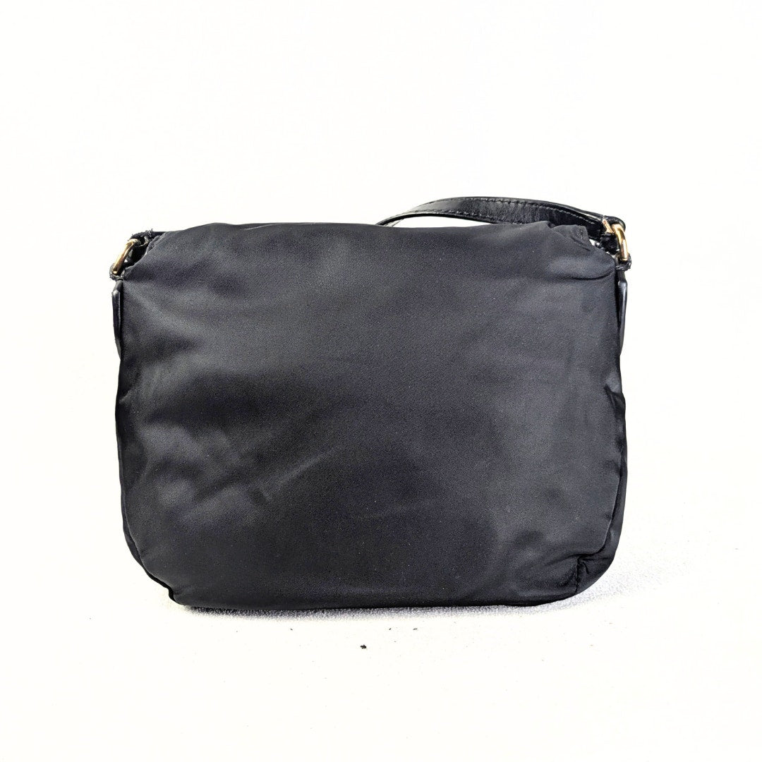 The back view of the Marc Jacobs Preppy Nylon Mini Natasha Crossbody Bag.