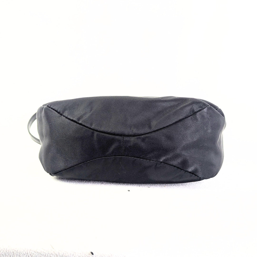 The bottom of the Marc Jacobs Preppy Nylon Mini Natasha Crossbody Bag.