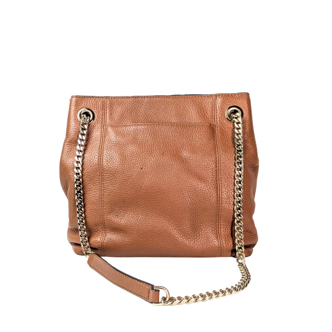 The back side of the Michael Kors Jet Set Chain Medium Tote Bag photographed on the white background.