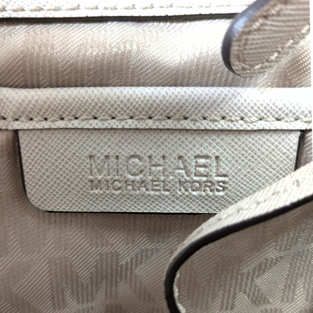 The logo patch inside of the Michael Kors Jet Set Medium Saffiano Leather Tote.