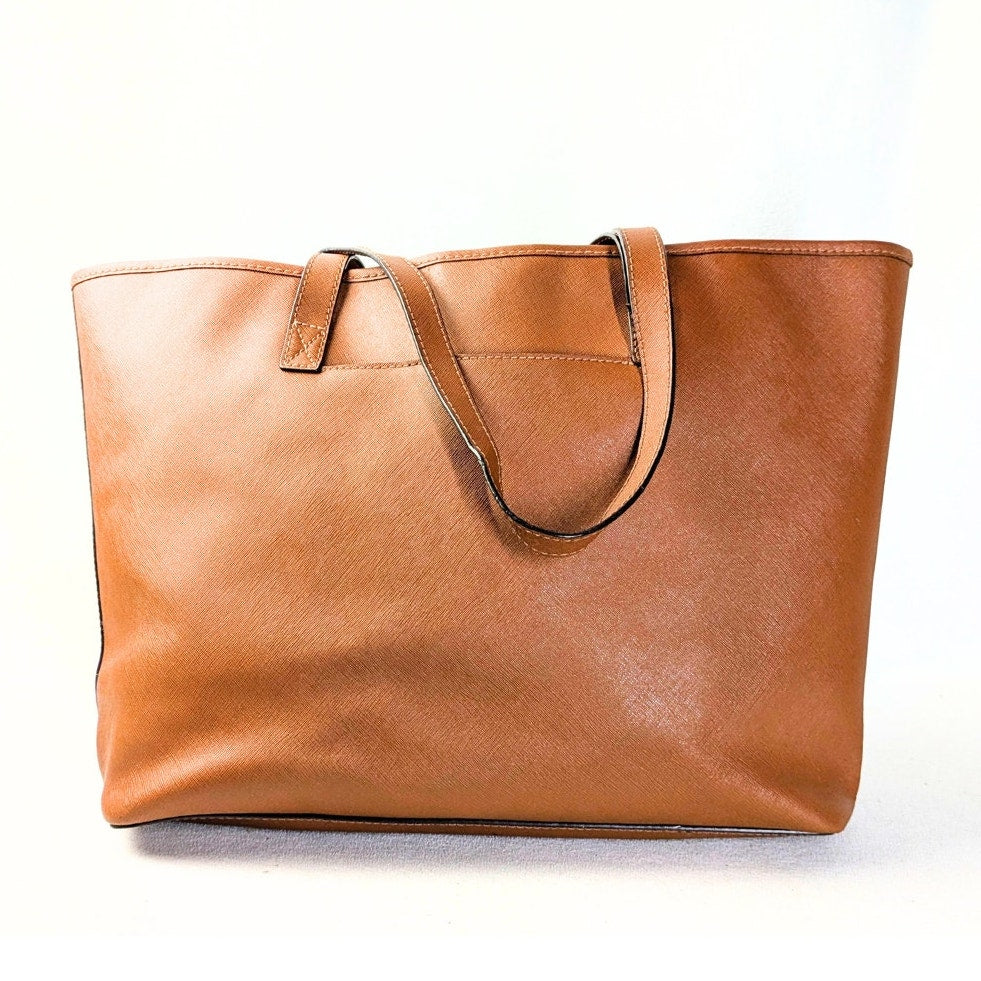 The back side of the Michael Kors Jet Set Medium Tote Bag in Camel on the white background.