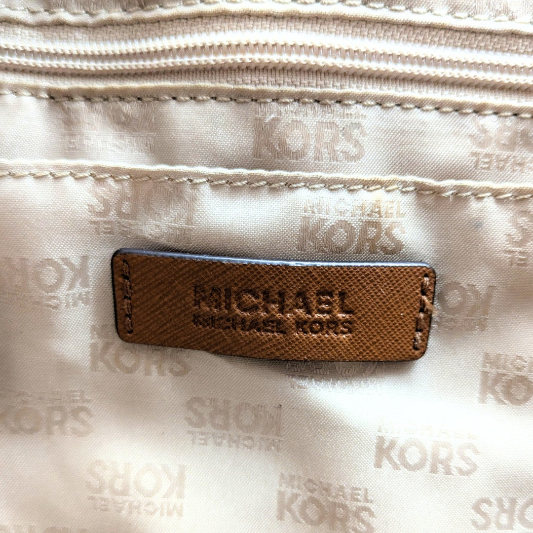 The leather embossed patch inside the Michael Kors Jet Set Medium Tote Bag.