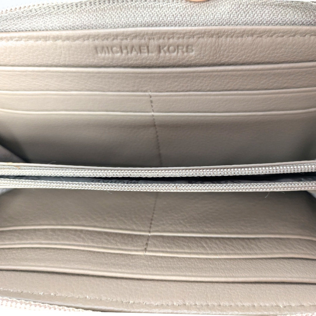 The interior fo the Michael Kors Saratoga Zip Around Continental Wallet.