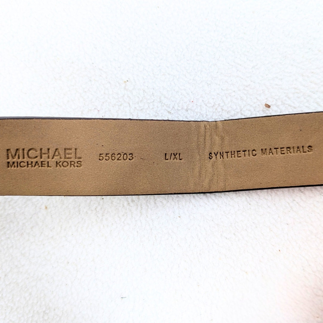 The back side of the leather belt of the Michael Kors Signature MK Belt Wallet Waist Bag, captured on the white background.