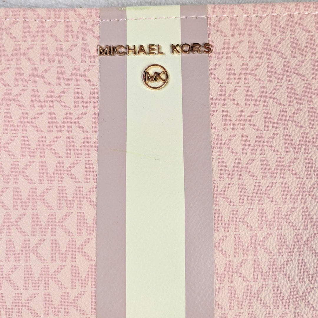 The exterior metal logo of the Michael Kors Signature MK Belt Wallet Waist Bag.