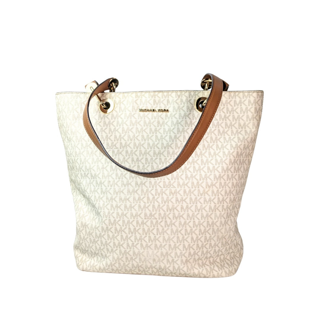 The front side of the Michael Kors Signature Raven Large North South Top Zip Tote on the white background.