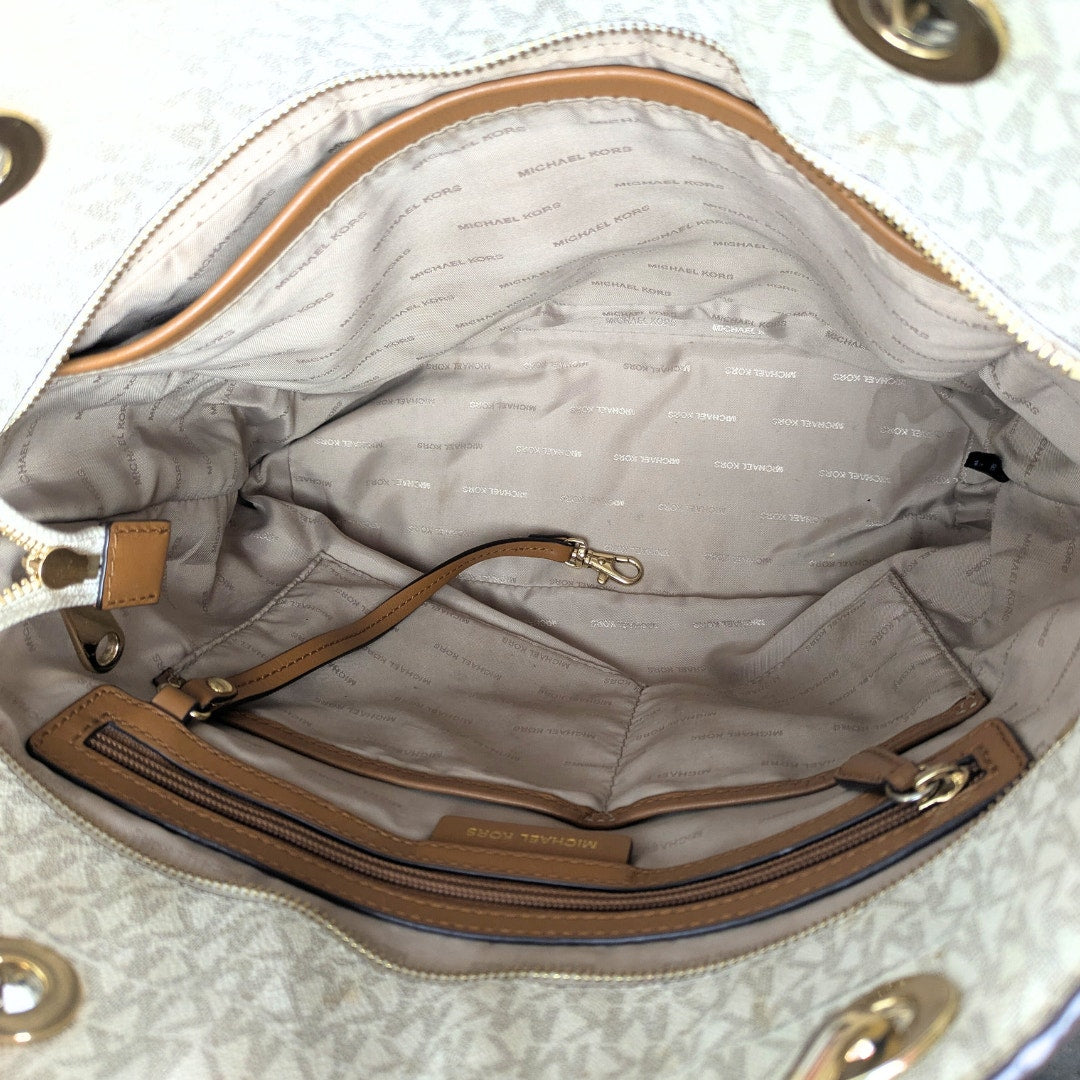 The interior of the Michael Kors Signature Raven Large North South Top Zip Tote.