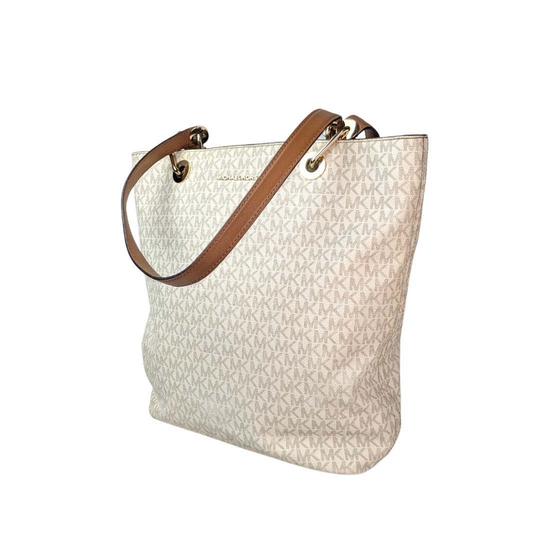 A beige and gray Michael Kors signature tote bag with gold-tone hardware and brown leather shoulder straps.