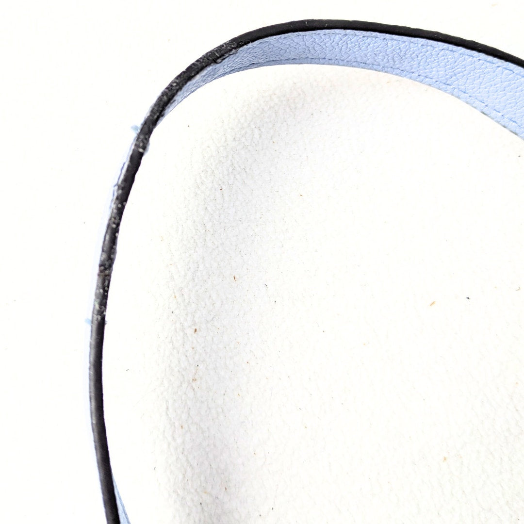 The close-up view of the shoulder strap of the Nine West Two-Way Tote Bag with a Crossbody Strap photographed on the white background.