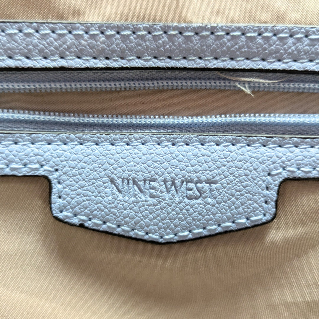 The leather embossed logo patch inside the Nine West Two-Way Tote Bag with a Crossbody Strap.