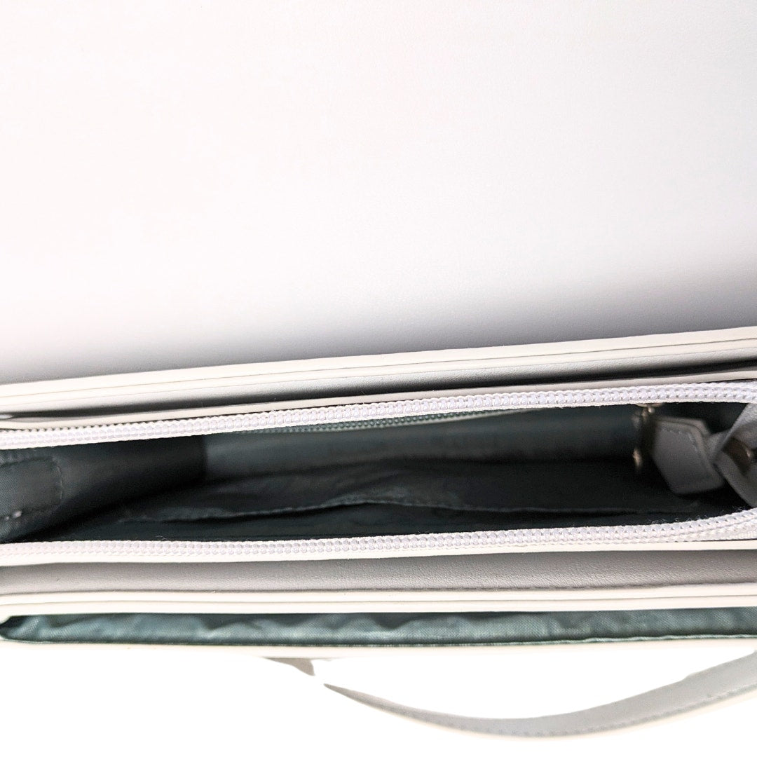 The view of the interior of the Pixie Mood Zoe Crossbody Vegan Leather Shoulder Bag.