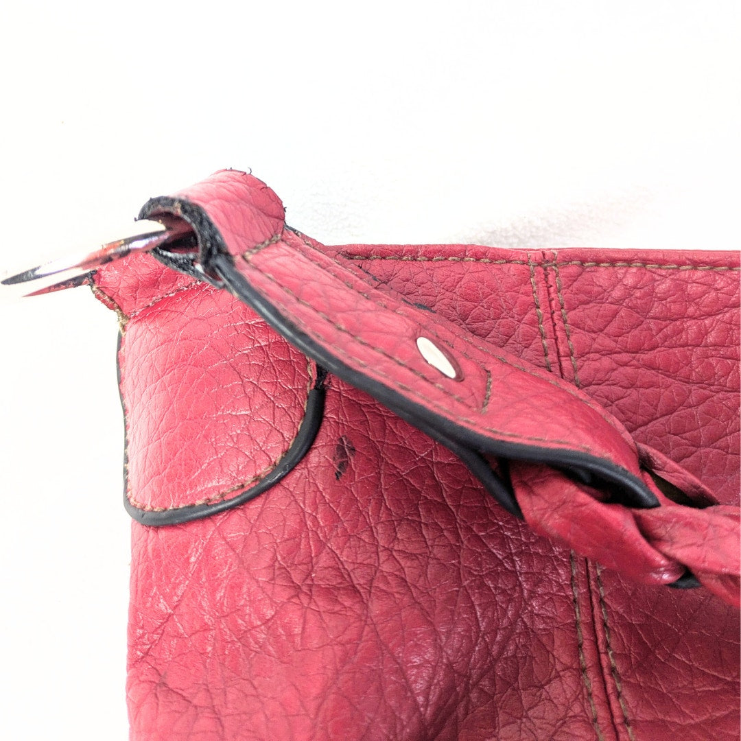 The view of flaws around the shoulder strap area of the Pre-loved Rosetti Faux-Leather Hobo Shoulder Bag
