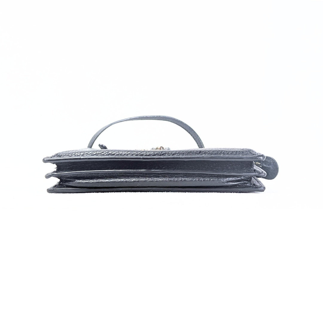 The bottom of the Pre-owned Kate Spade Larchmont Avenue Alegra Crossbody Bag.